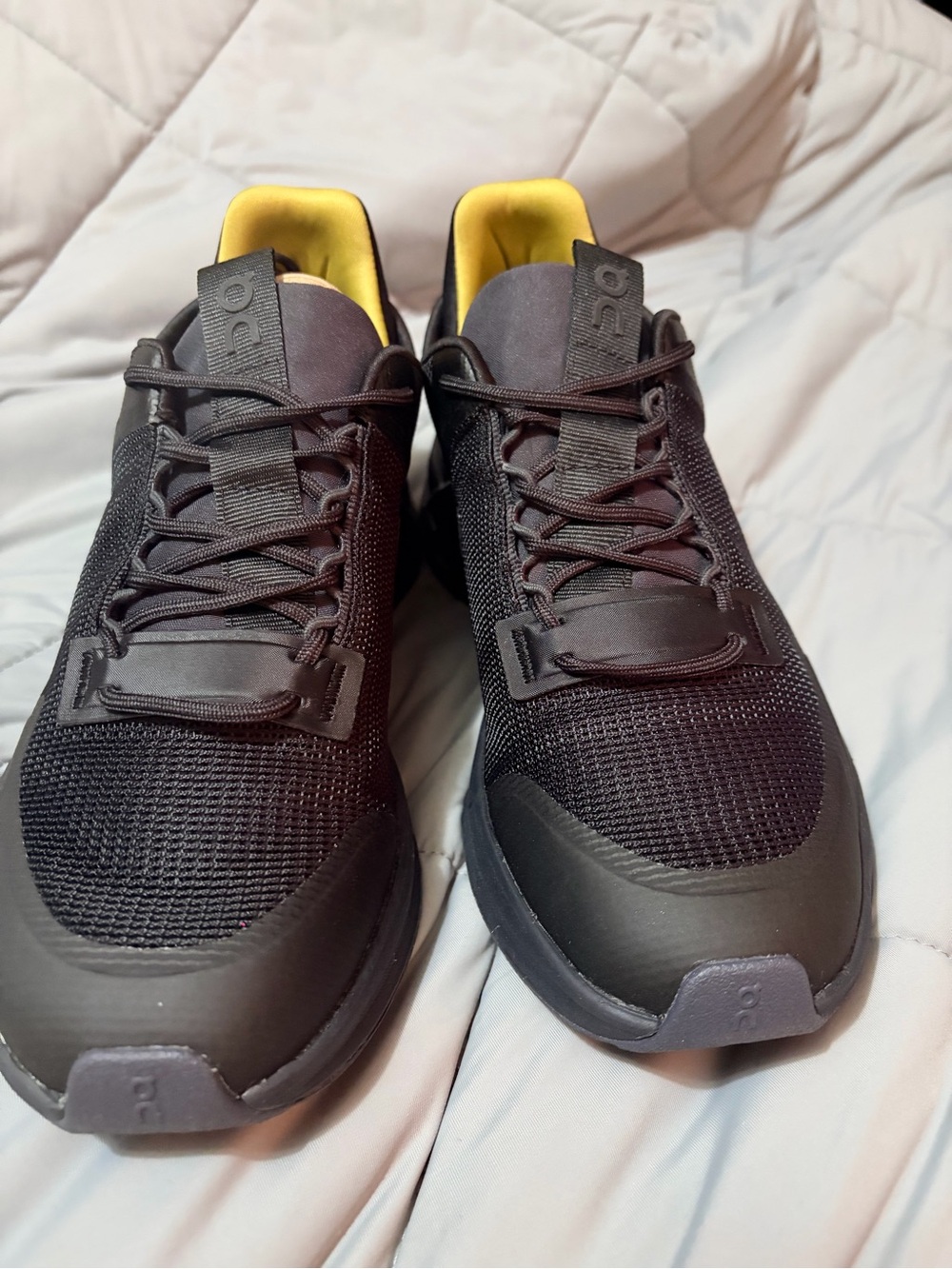 On Running Black Sneakers with Yellow Lining